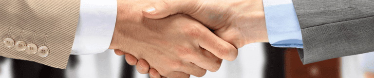 Handshake between business professionals representing virtual office services and virtual receptionist solutions.