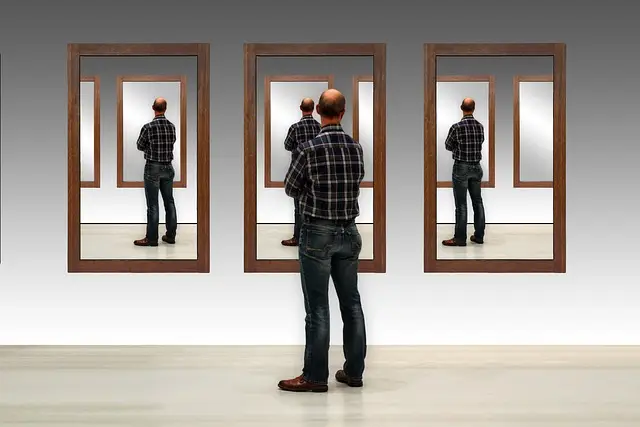 Illustration of a man standing in front of a mirror looking at himself with repeating mirrors stationed beside him, repeating his reflection over and over.