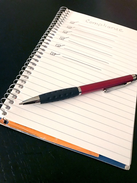 Spiral notebook with hand written checklist. A pen sits across the paper