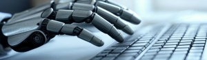 close-up of a robotic hand typing on a keyboard
